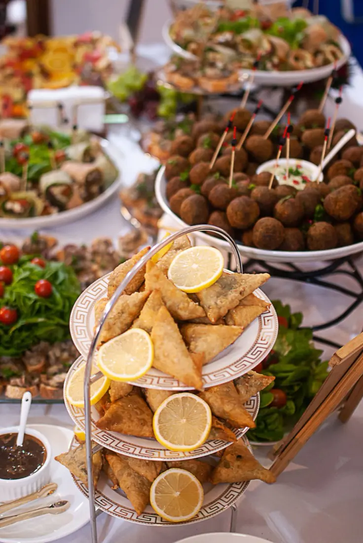 Dishes laid out along a catering buffet